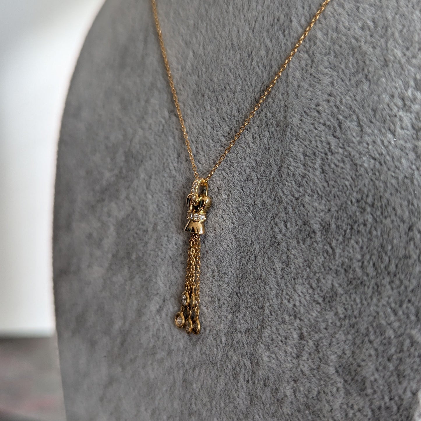 4. ダイヤモンドタッセルネックレス YG 0.33ct